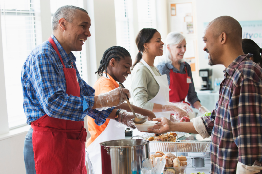 Smiling volunteer experiencing a healthy volunteer culture at a nonprofit