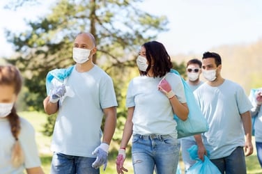 volunteers working together while wearing masks