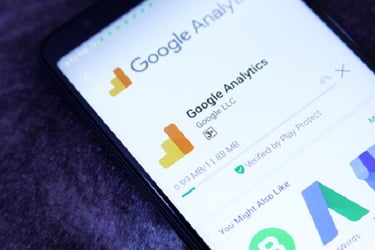 mobile phone screen showing the Google Analytics app being downloaded