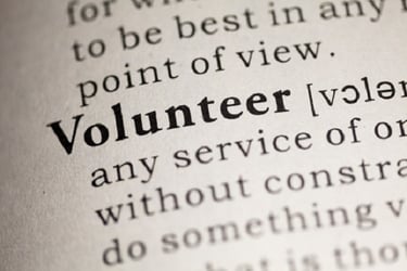 dictionary page zoomed in on the definition of 'volunteer'