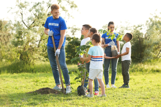 young volunteers planting trees