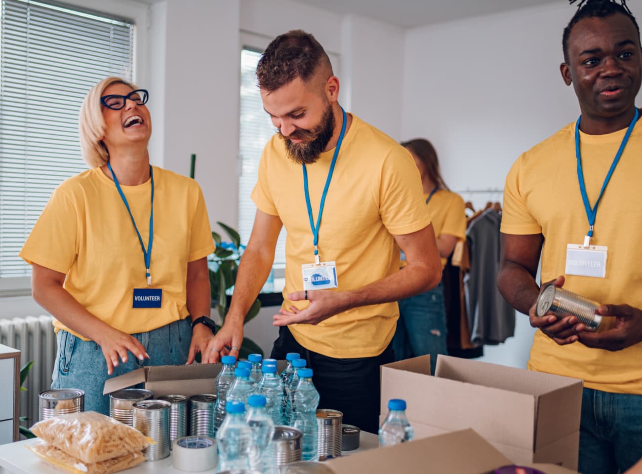 Volunteers enjoying their time packing food boxes. 